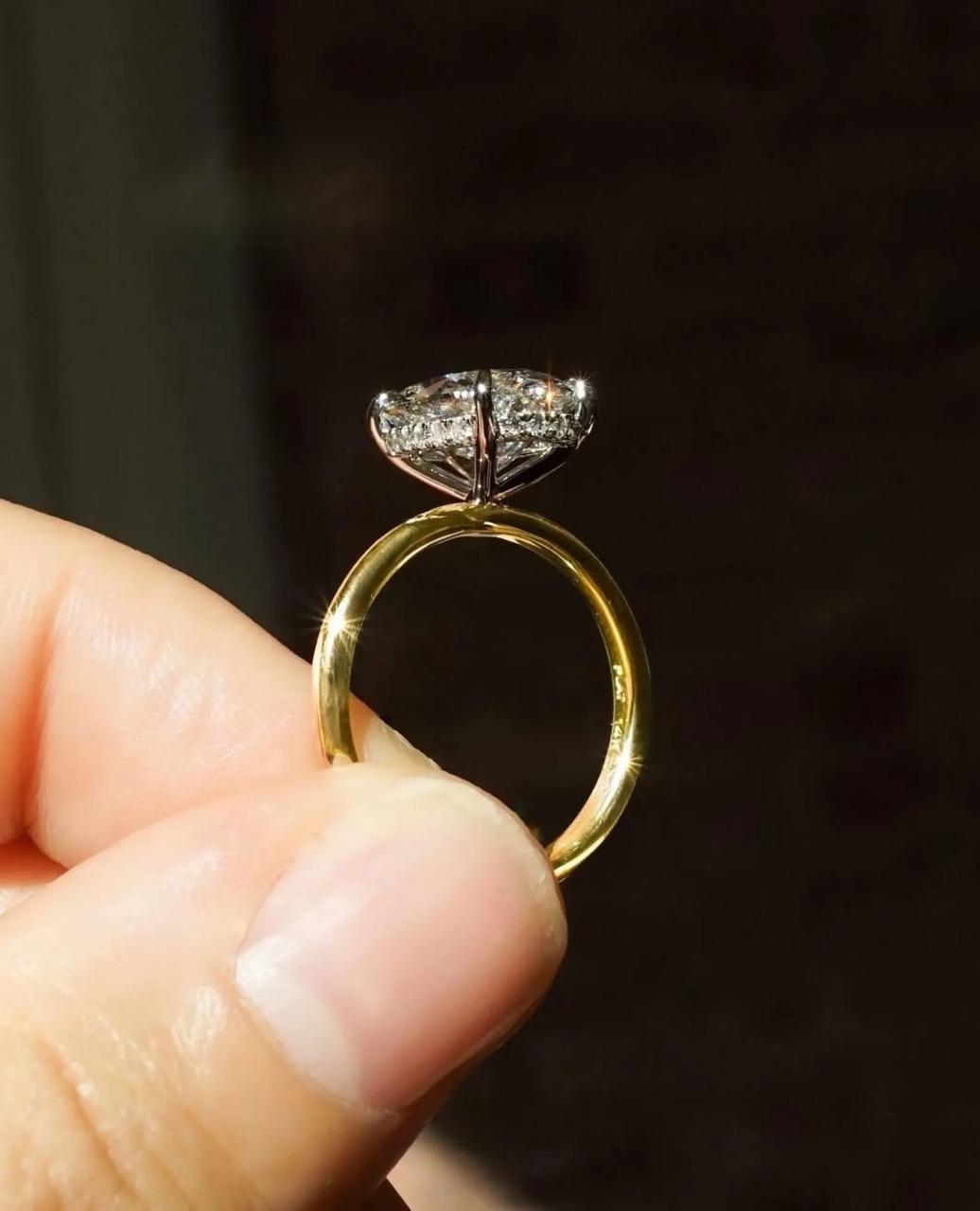 Custom gold solitaire ring